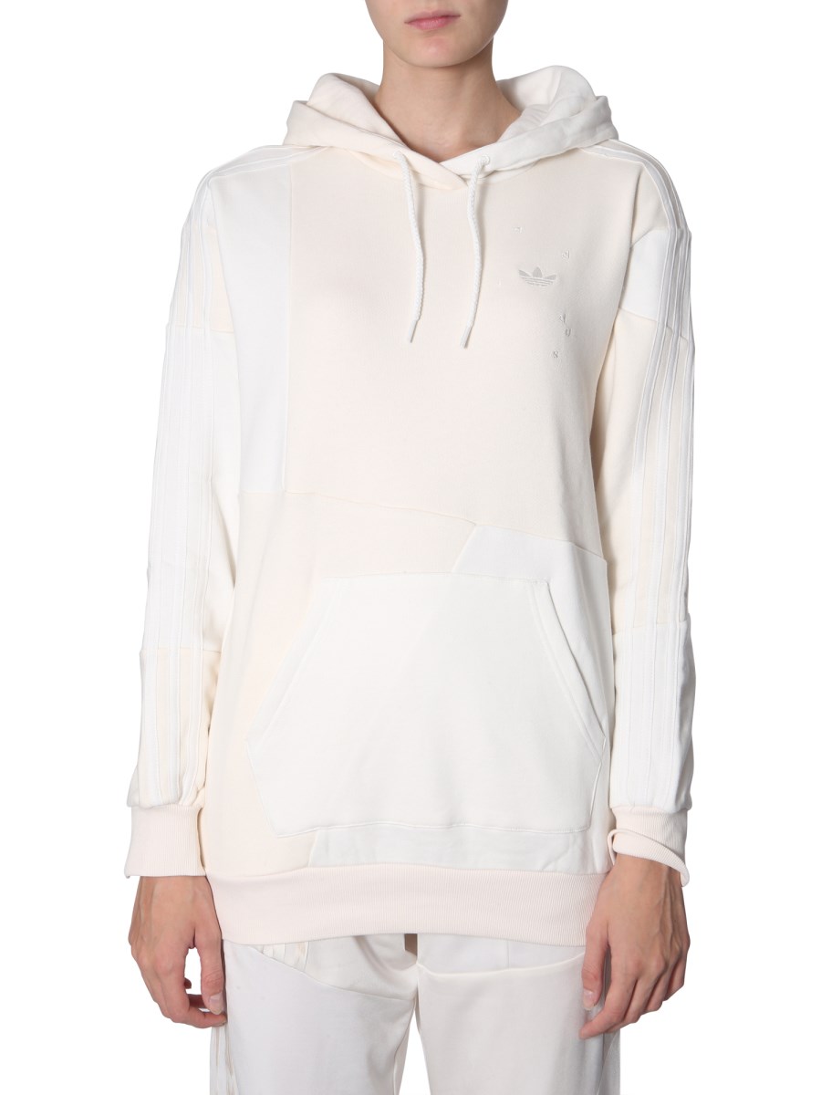 ADIDAS ORIGINALS BY DANIELLE CATHARI HOODED COTTON SWEATSHIRT WITH ASYMMETRICAL PATCHES Eleonora Bonucci