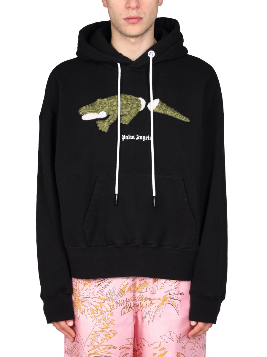 PALM ANGELS - LOS ANGELES SPRAYED LOGO PRINT HOODIE - Eleonora Bonucci