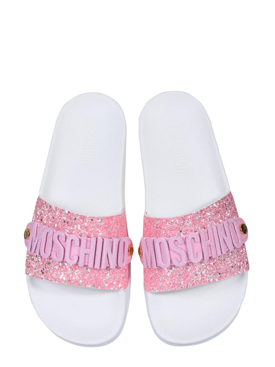 MOSCHINO GLITTER LETTERING LOGO SLIDE SANDALS Eleonora Bonucci