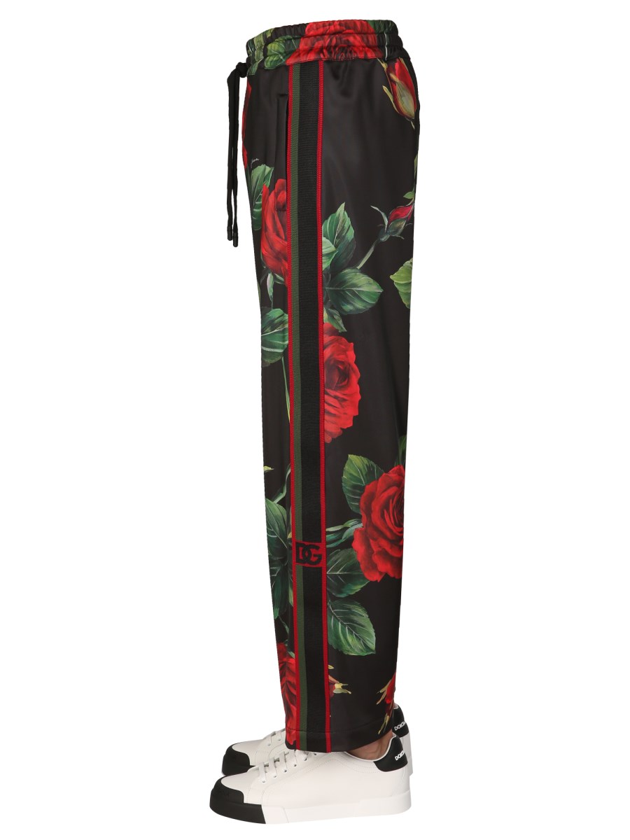 DOLCE & GABBANA - PANTALONE JOGGING IN JERSEY TECNICO CON STAMPA ROSE - Eleonora  Bonucci