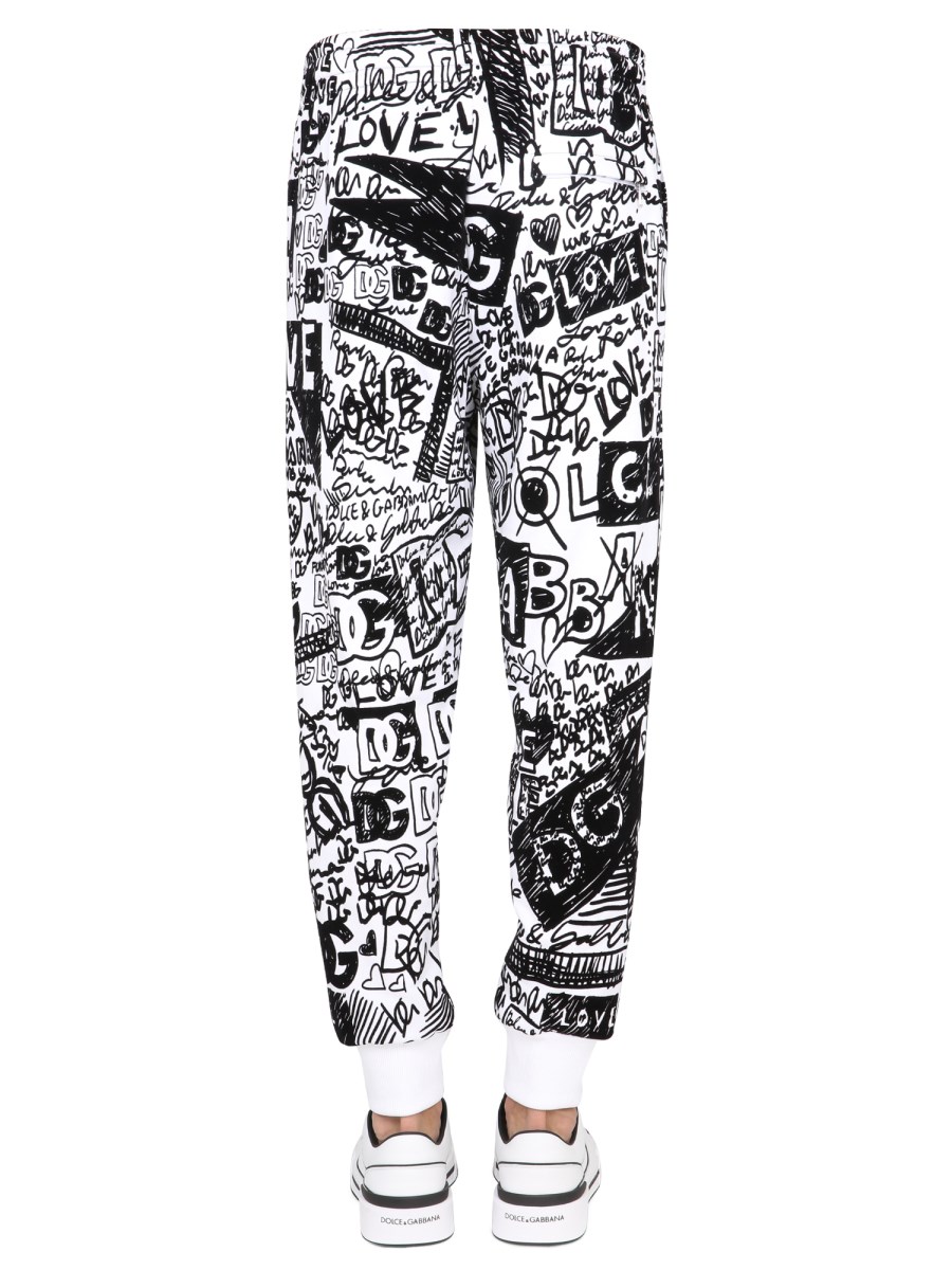 DOLCE GABBANA COTTON JOGGING PANTS WITH FLOCKED GRAFFITI PRINT