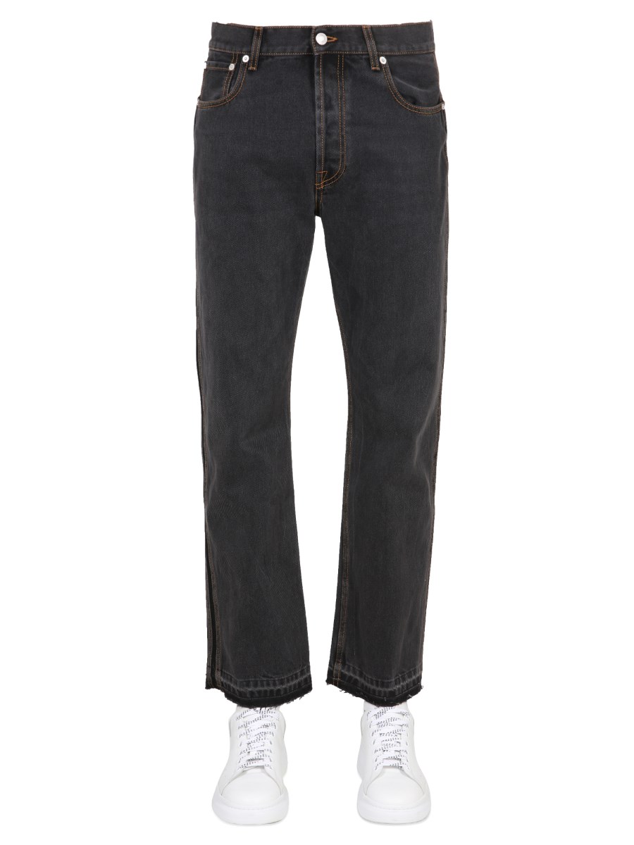 ALEXANDER McQUEEN JEANS IN DENIM DI COTONE GIAPPONESE CON TAGLIO A VIVO