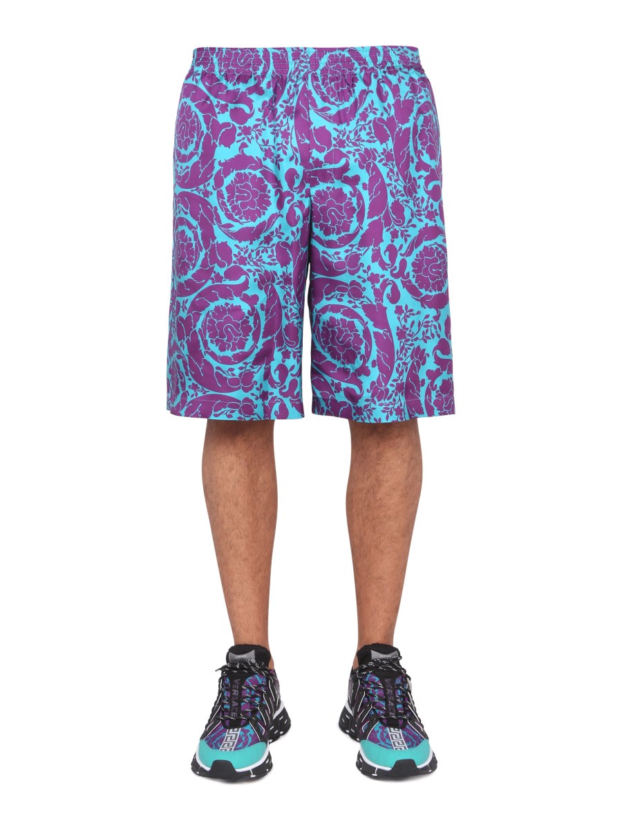 Logo-printed swim shorts in multicoloured - Versace