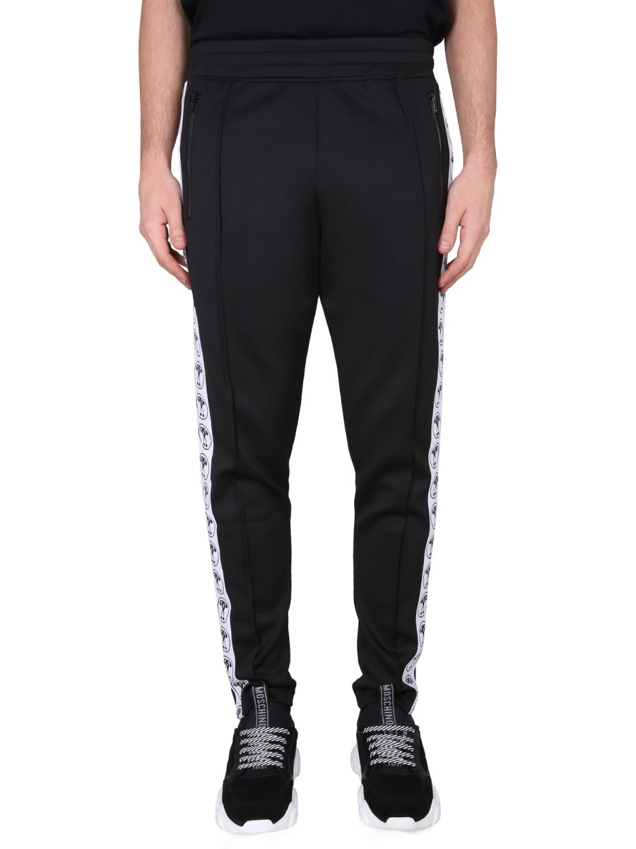 MOSCHINO PANTALONE JOGGING IN FELPA TECNICA CON LOGO JACQUARD