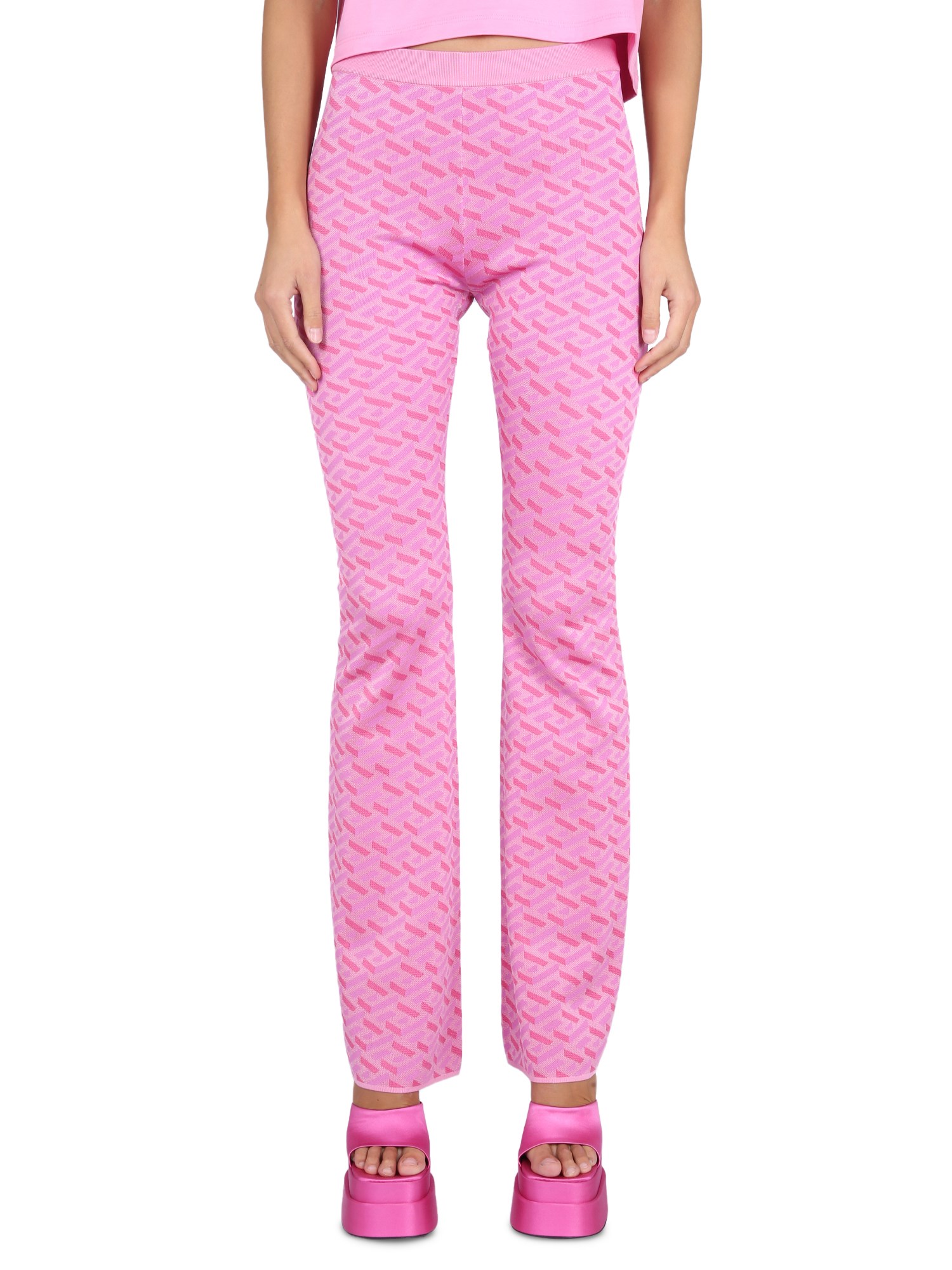 Versace La Greca Patterned Silk Blend Trousers In Pink