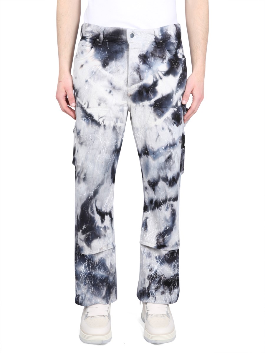 AMIRI JEANS CRACKED TIE-DYE CARPANTER IN DENIM DI COTONE