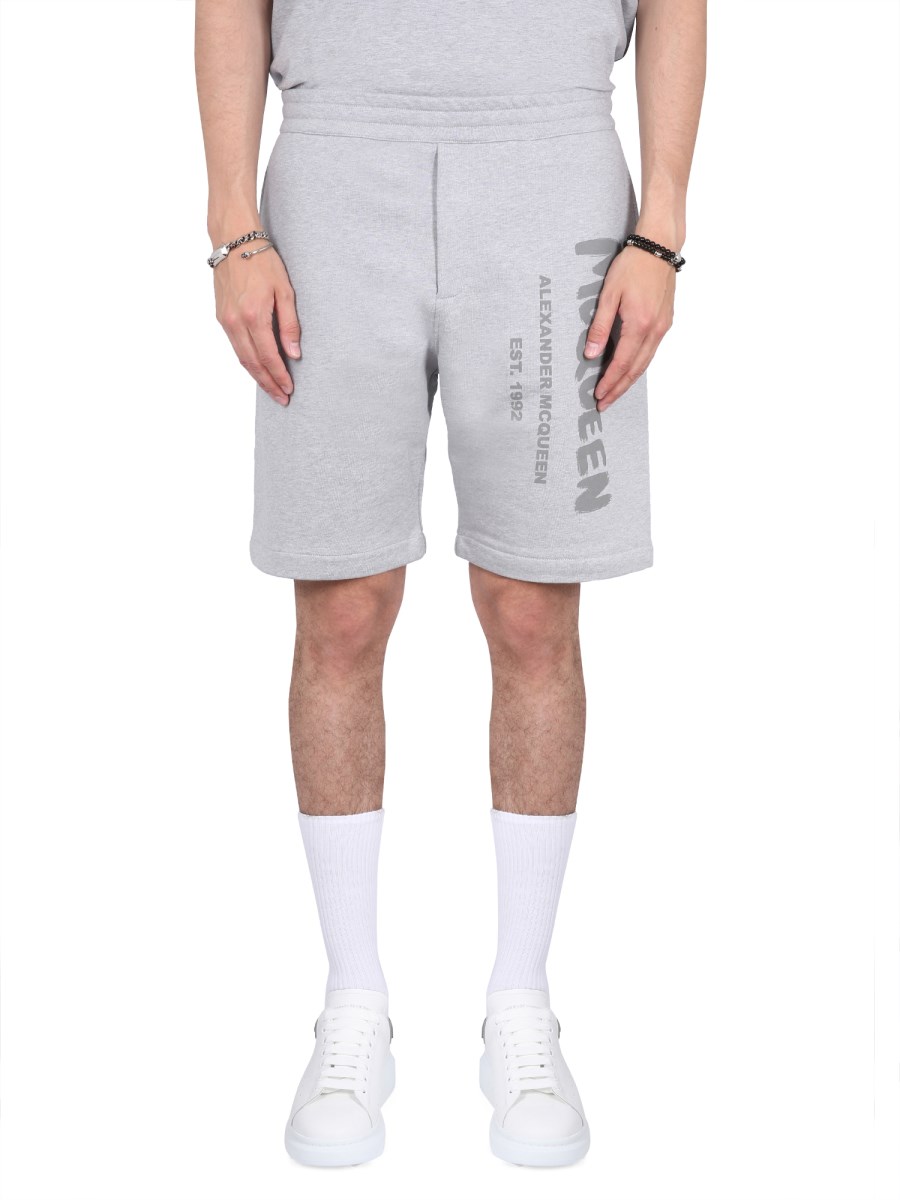 ALEXANDER McQUEEN - COTTON BERMUDA SHORTS WITH GRAFFITI LOGO PRINT