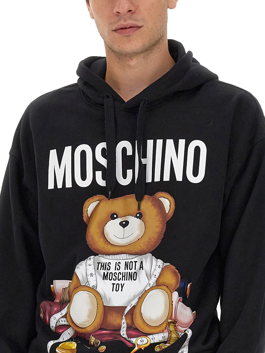 Felpa moschino uomo cappuccio best sale