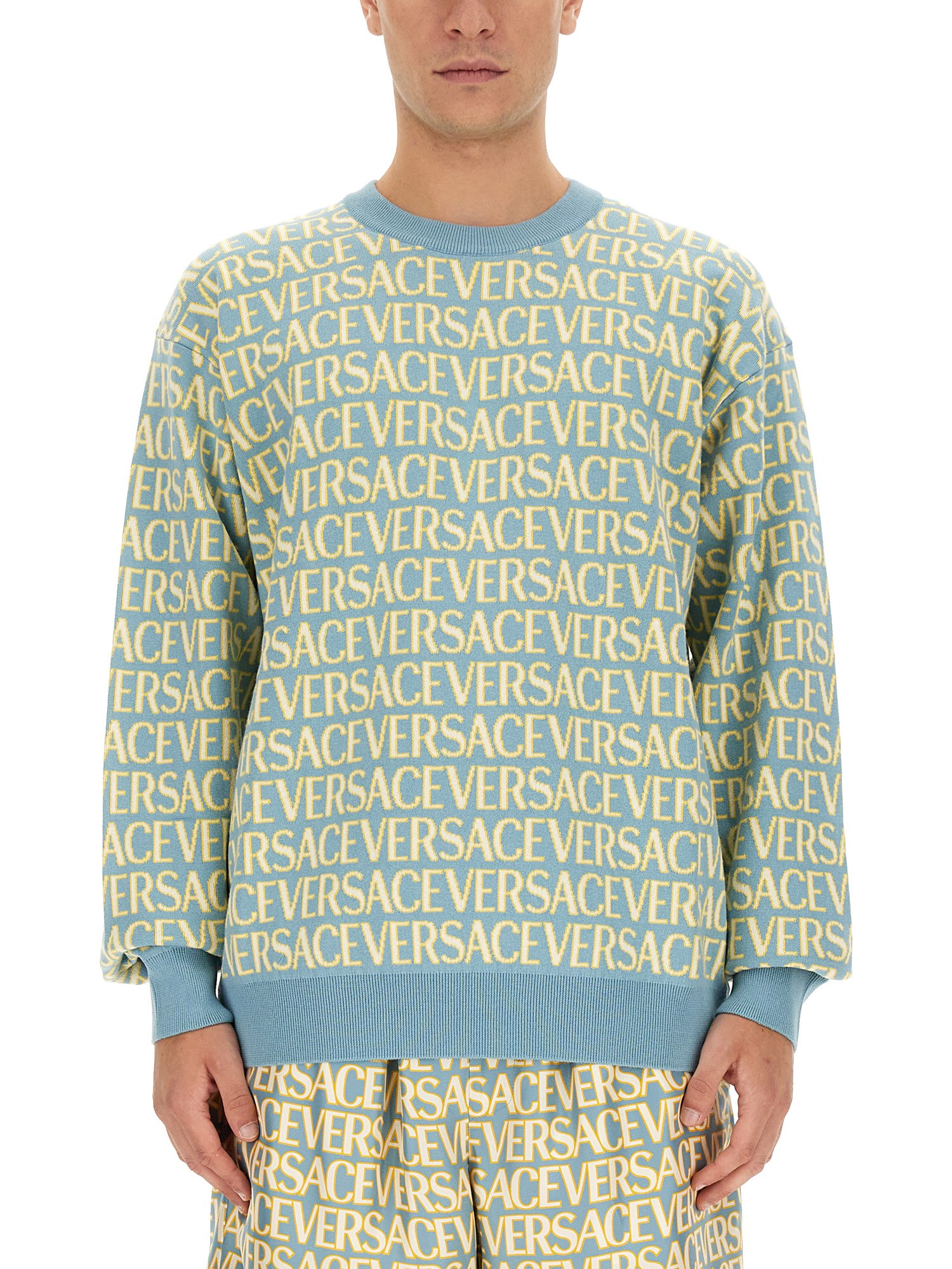Shop Versace Allover Logo Jersey In Multicolour
