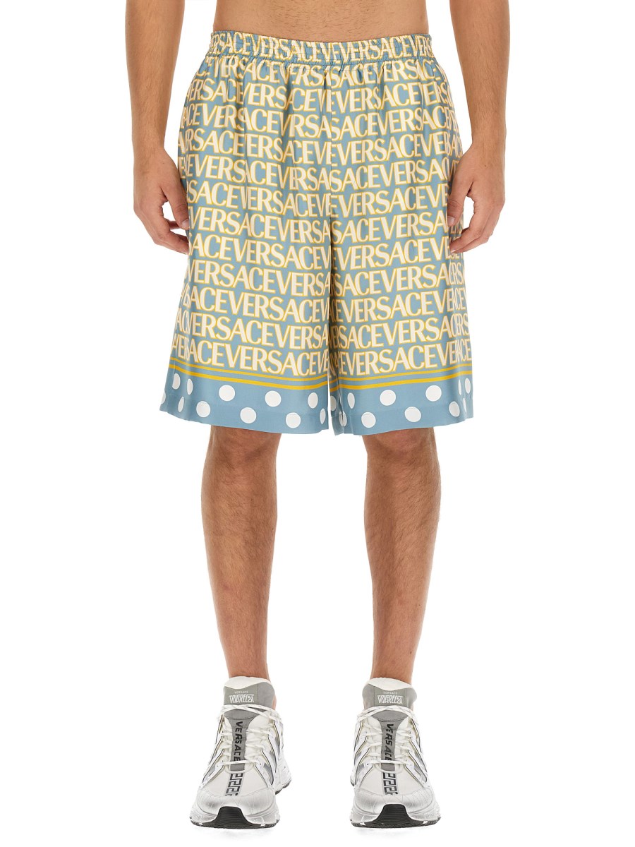 VERSACE - SILK SHORTS WITH LOGO PRINT - Eleonora Bonucci