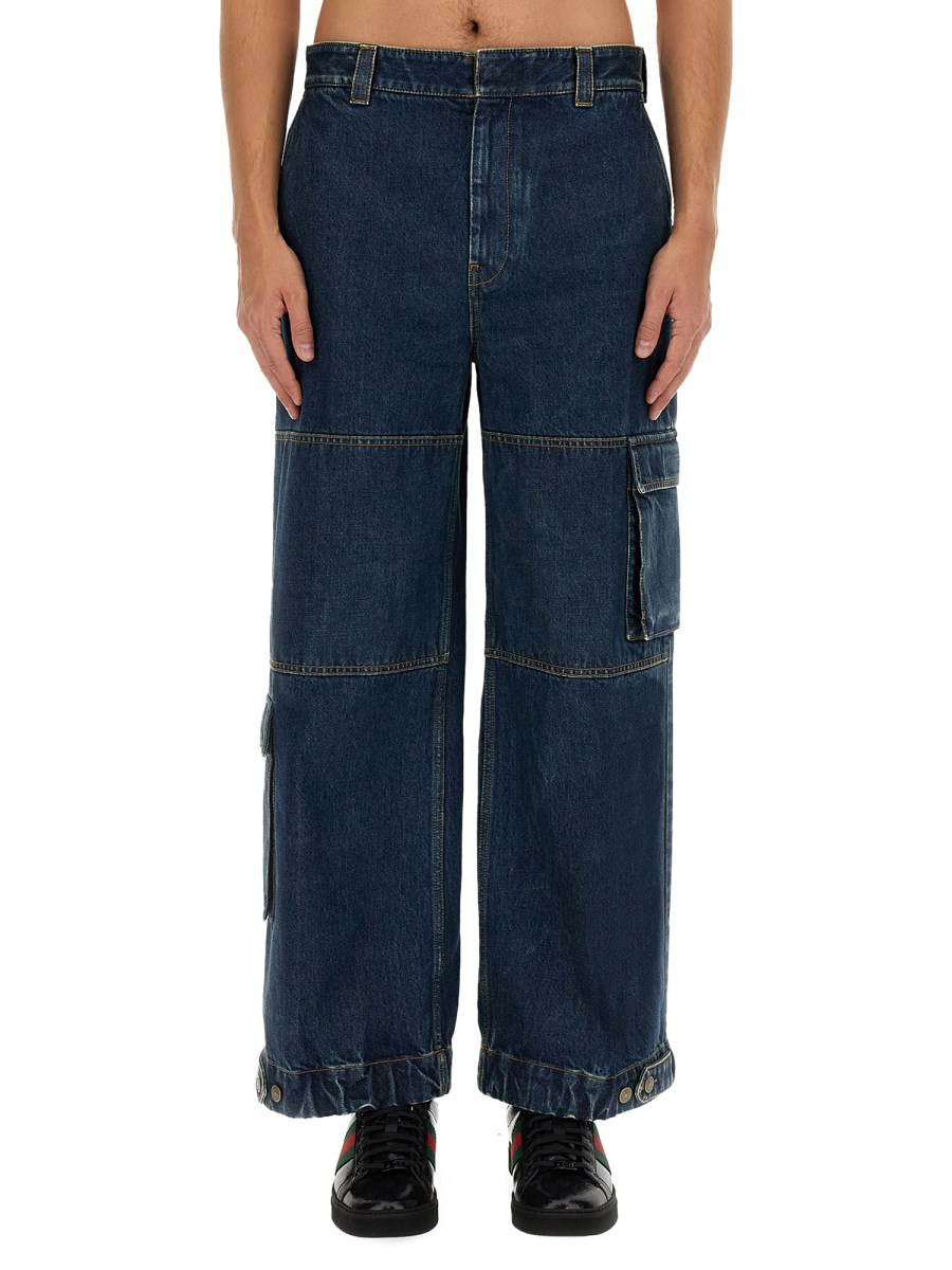 GUCCI PANTALONE IN DENIM CON ETICHETTA GUCCI