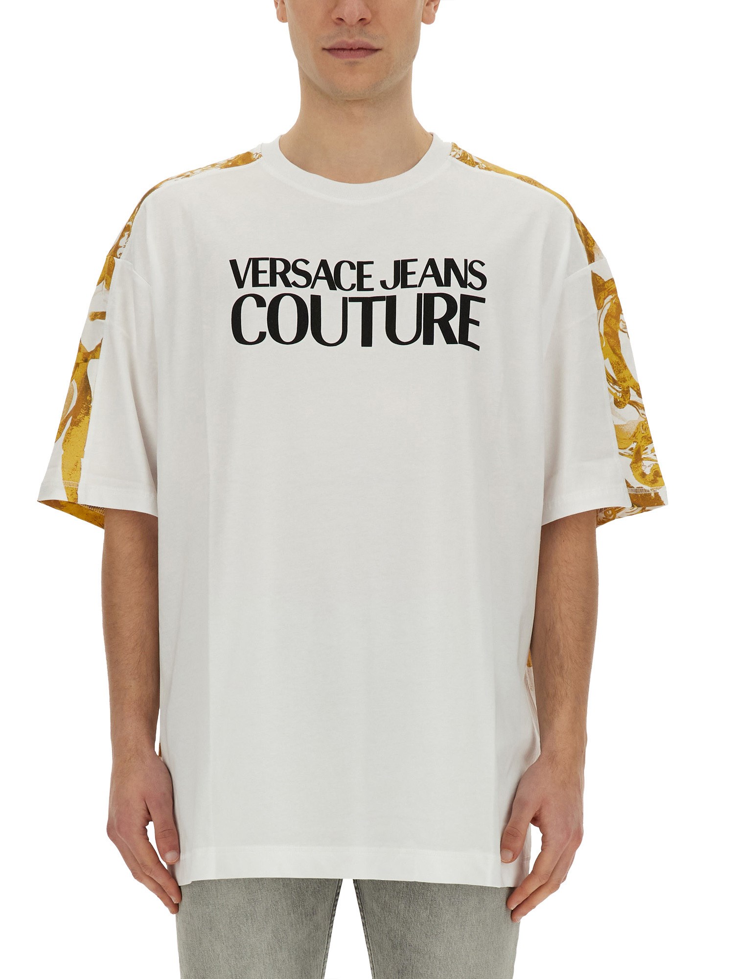Versace Jeans Couture Oversized T-shirt With Bold Logo And Intricate Patterned Sleeves In White