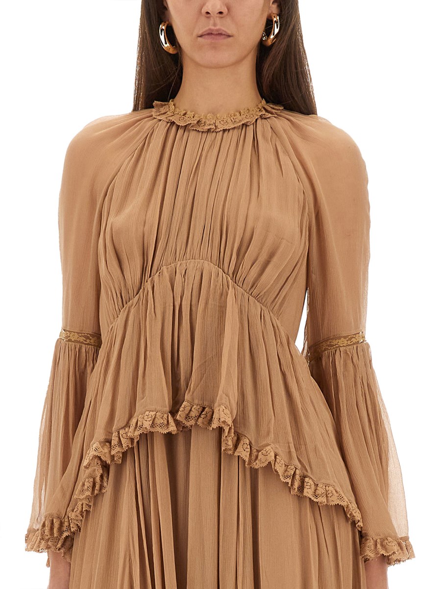 ABITO CON VOLANT HYPNOTIC PEPLUM