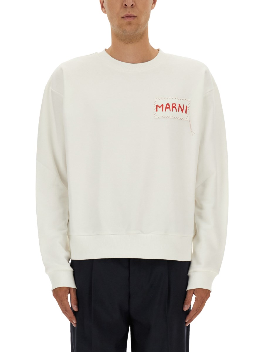 FELPA CON PATCH LOGO