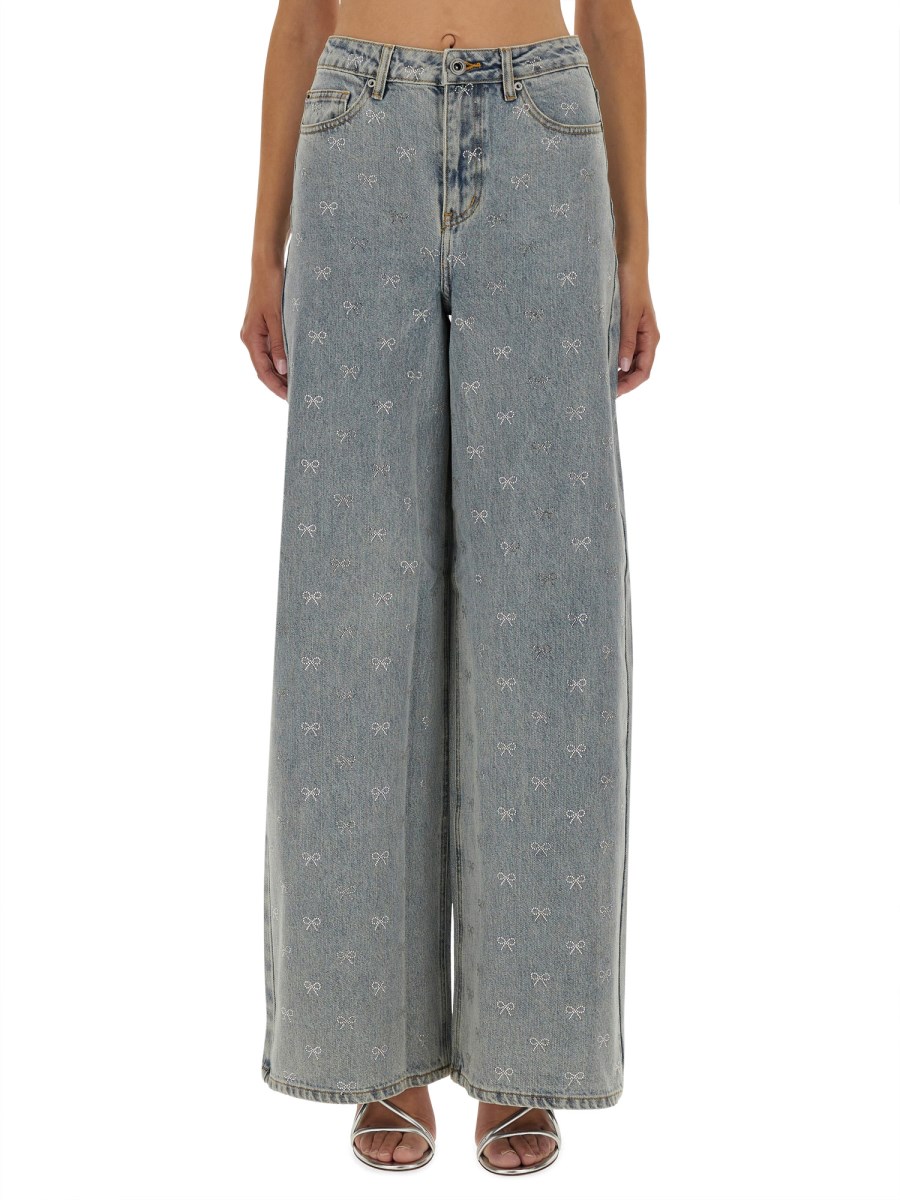 JEANS CON FIOCCHI STRASS