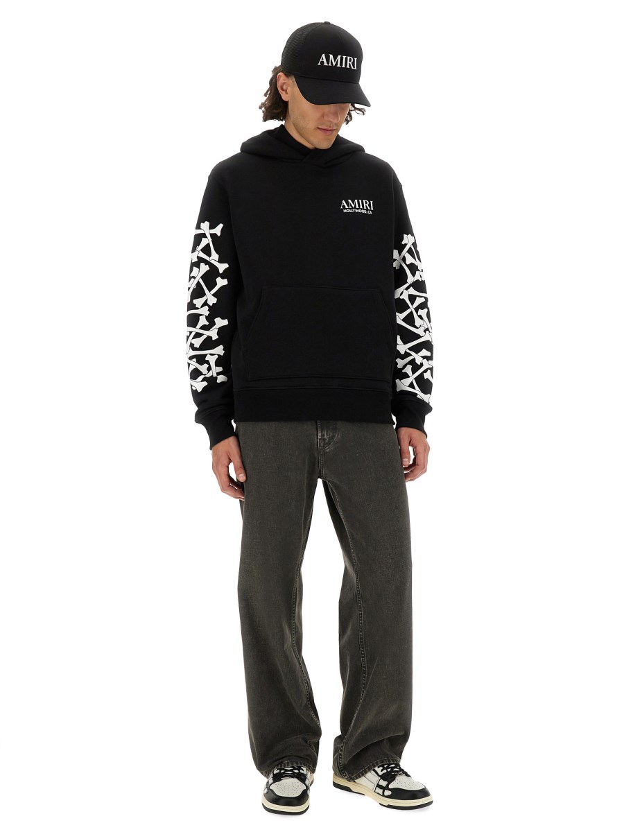FELPA STAMPA BONES STACKED CON CAPPUCCIO