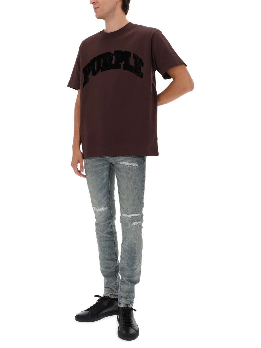 PANTALONE CON DETTAGLI USURATI