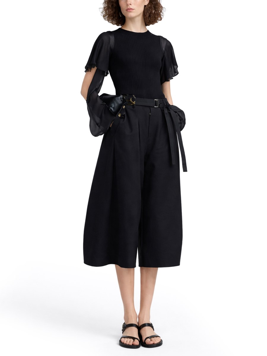 MAGLIA CON MANICHE SEMITRASPARENTI