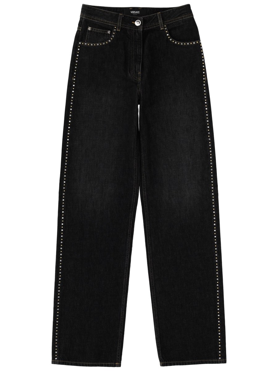 JEANS CON DECORAZIONE BORCHIE E CRISTALLI