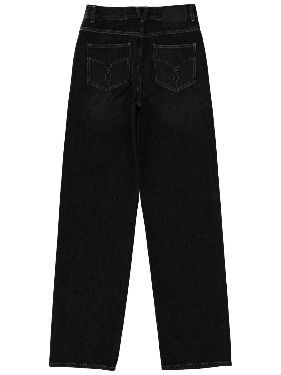 JEANS CON DECORAZIONE BORCHIE E CRISTALLI