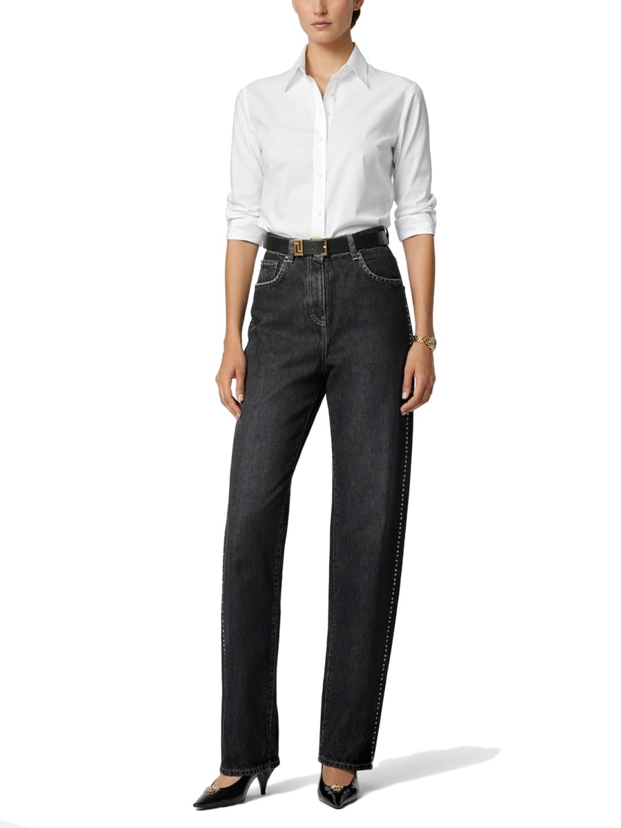 JEANS CON DECORAZIONE BORCHIE E CRISTALLI