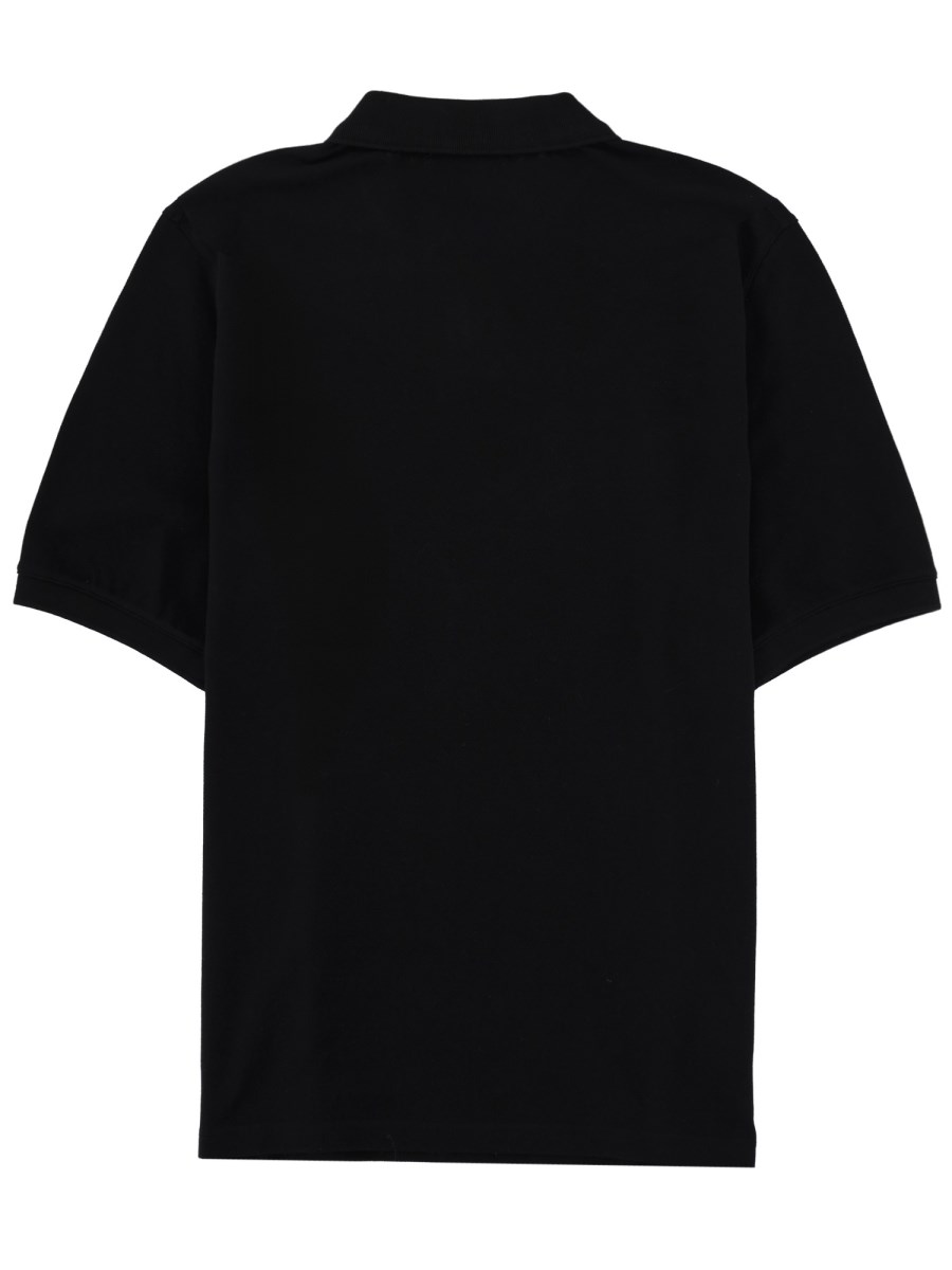 POLO CON ZIP E PATCH LOGO