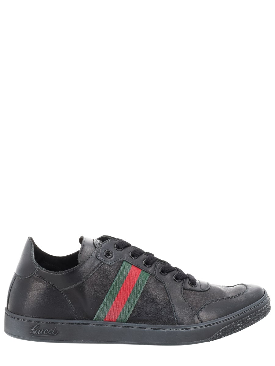 SNEAKER IN PELLE EFFETTO STRETCH