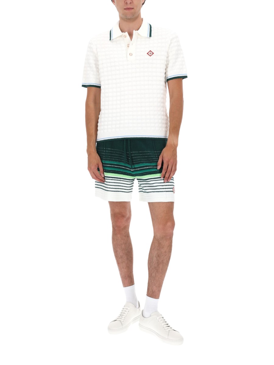 POLO BOUCLÉ CON LOGO