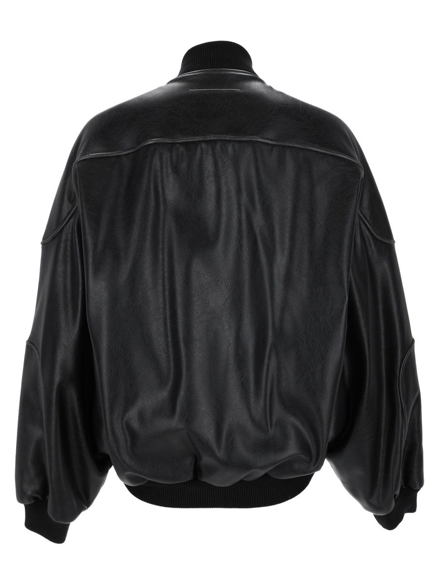 Giacca in ecopelle con bordi in maglia a coste